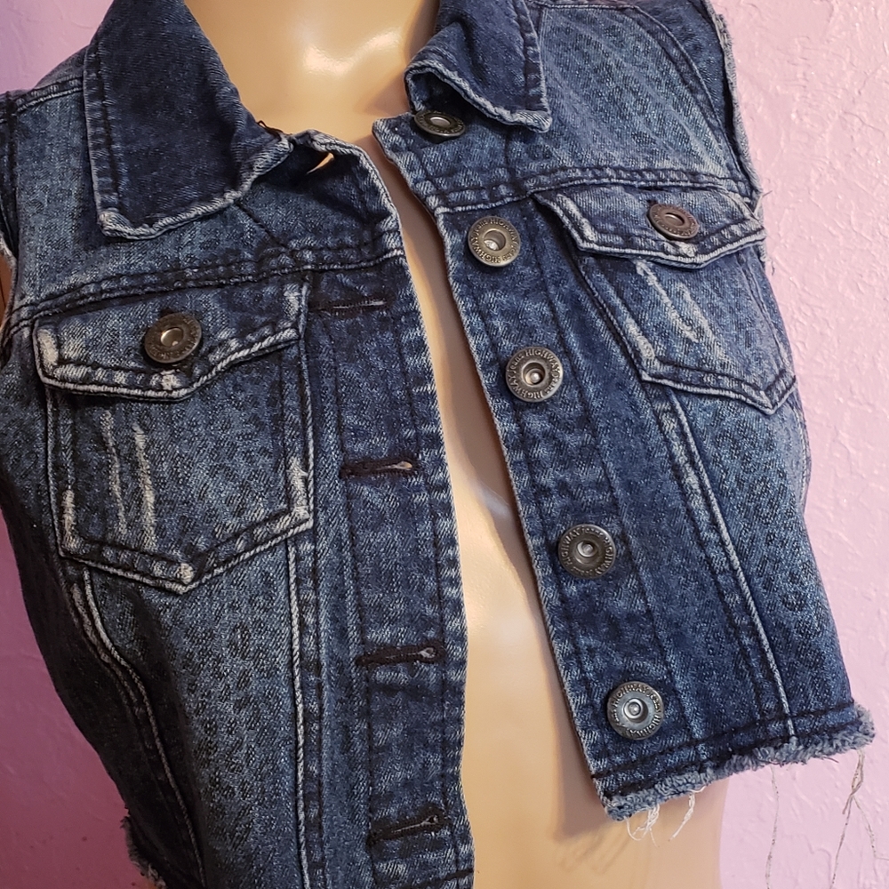 Pre- owned dark blue jean vest. Size Small